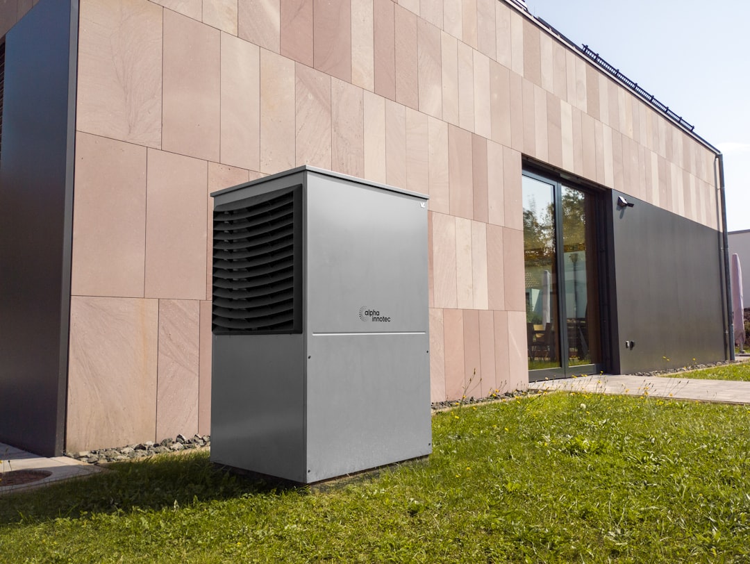 modern outdoor AC condenser unit installed beside a suburban home - how long does an ac replacement take