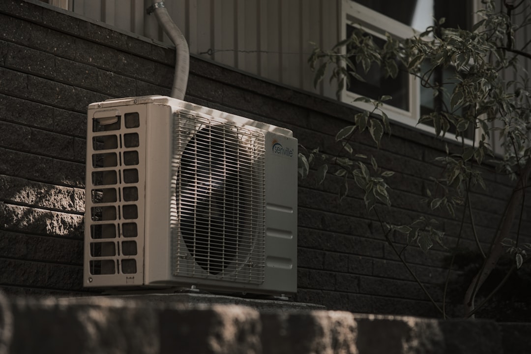 newly installed outdoor AC unit next to a suburban home on a clear day - what happens after your new ac system is installed